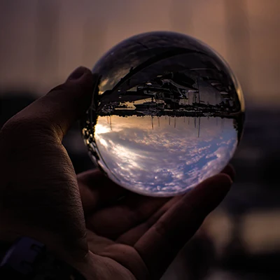 Clear crystal held in a person's hands
