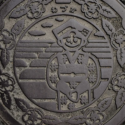 Sewer manhole cover picuring a smiling face